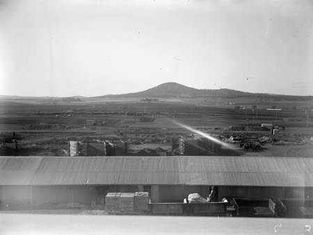 Parliament House builders sheds, stores being unloaded from rail trucks.