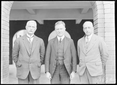 Dr Earle Page MHR, Commonwealth Treasurer with Mr. James Thomas Heathershaw, Secretary of The Treasury (left) and Sir Henry Sheehan, Assistant Secretary of The Treasury (right).