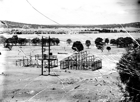 Site for the CSIR showing electricity transformer and wooden framed building under construction,Negative cracked