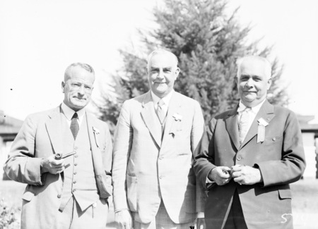 Second Conference of 65th District of Rotary. Three of the executive committee outside Hotel Canberra.