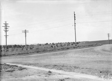 Rows of various power transmission lines and telephone lines around City Hill.