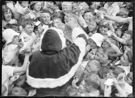 Santa Clause spreading presents to children at Telopea Park School Telopea Park School, New South Wales Crescent, Barton.
