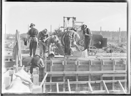 Manuka swimming pool, under construction, pouring concrete for the walls, Manuka Circle, Kingston.