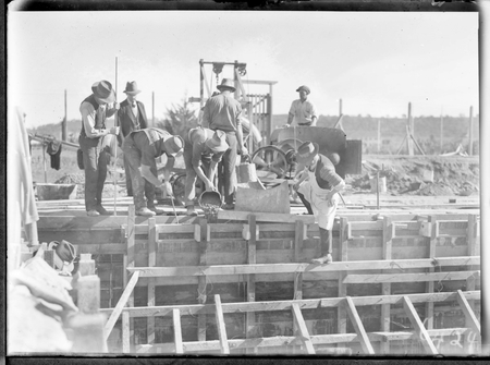 Manuka swimming pool, under construction, pouring concrete for the walls, Manuka Circle, Kingston.