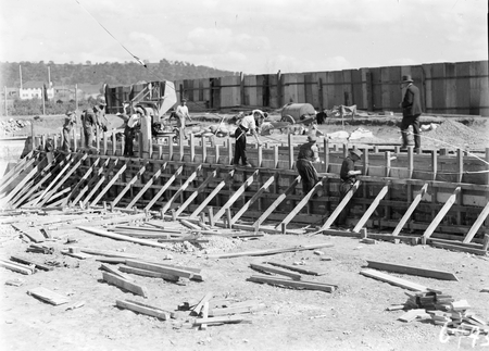 Manuka swimming pool under construction. Concrete being poured for the walls. Manuka Circle, Kingston.
