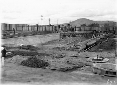 Manuka swimming pool under construction. Walls now complete, formwork being removed. Manuka Circle, Kingston.