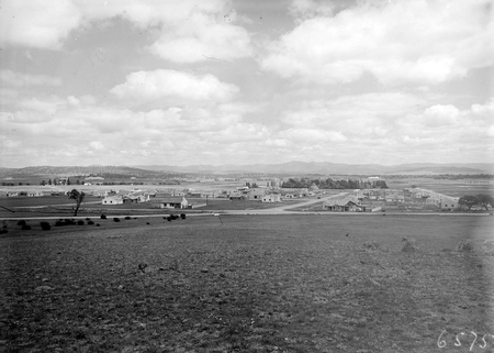 Cottages in Reid, from the north, St Johns Church in the trees.