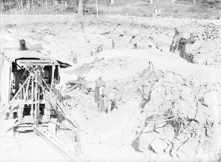 Steam shovel and workmen in the excavation of the reservoir at Black Mountain.