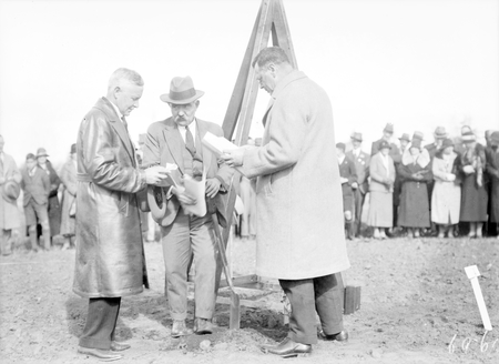 First plantings of National Rose Garden in front of Parliament House. Minister for the Interior Mr. J. A. Perkins planting the first rose with Mr. F.A. Piggins President of the Canberra Horticultural Society and Mr. C.S. Daley of the FCC.