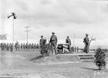 The flag draped Commemorative Stone with returned soldier sentries at the inauguration of the Australian War Memorial.
