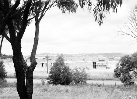 Australian War Memorial, under construction, from the north. Parliament House in right distance.