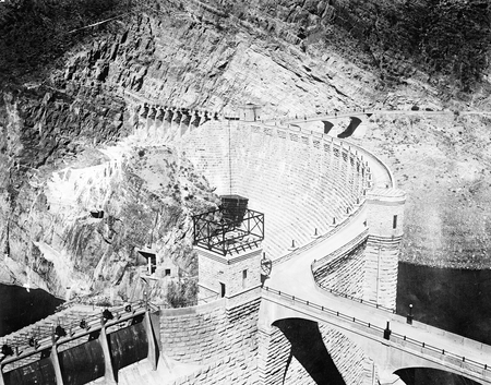 Photograph of picture of concrete arch wall of a dam.