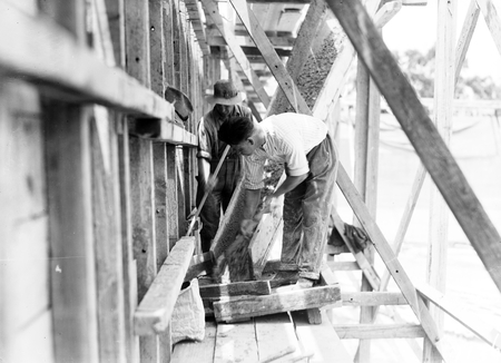 Black Mountain Reservoir, under construction. Form work for concreting being erected.
