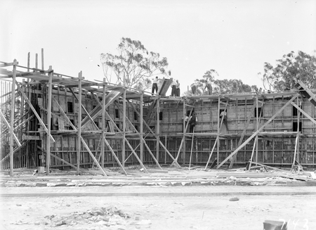 Black Mountain Reservoir, under construction. Form work and reinforcement for concreting being erected.