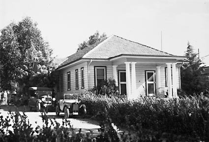 Canberra Community Hospital buildings with two motor cars