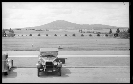 View to Mount Ainslie  from the main door of Parliament House. Essex tourer in front.