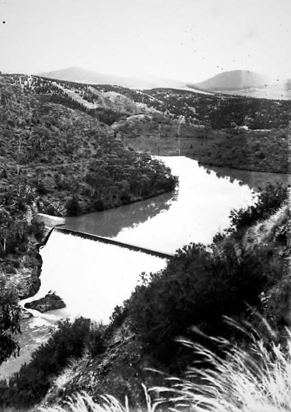 Cotter Dam over flowing the dam wall into the stilling pond