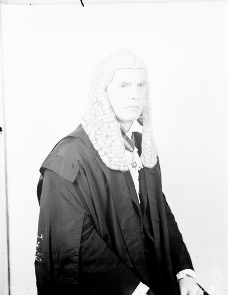 The Honourable GJ Bell in Speakers Robes of Office.