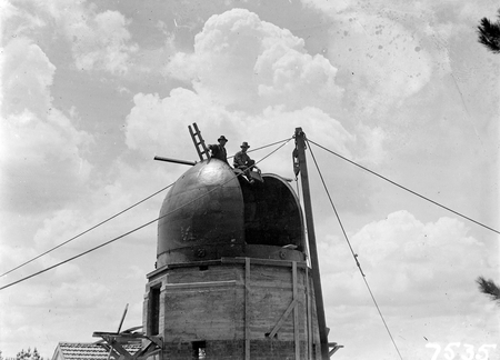 Workmen on the solar tower at the Commonwealth Solar Observatory on Mt Stromlo.