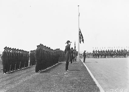 Armistice Day - Guard of Honour and Light Horseman taking the Salute. Flags at Half Mast