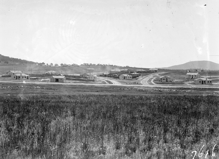 View of Flinders Way and houses near Monaro Crescent Red Hill.