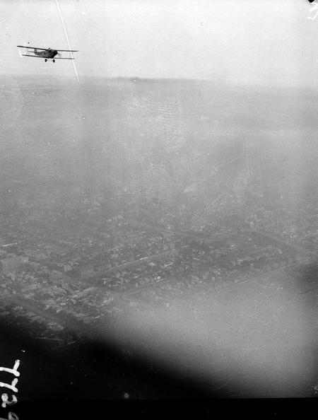 Flight to Central Australia. A town somewhere, aircraft in flight.